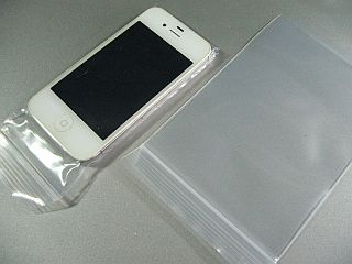 図1:キチキチに作ったポリ袋カバー <click>→図2:指紋汚れが気になる